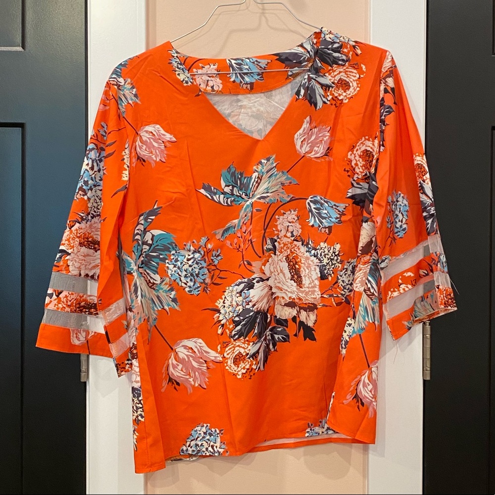 Floral top with accent sleeve